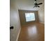 Bright bedroom with a ceiling fan and large window providing natural light and a view of the outdoors at 664 San Pedro Dr, The Villages, FL 32159