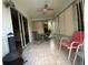 Covered lanai featuring tile flooring, neutral window shades, and a ceiling fan at 664 San Pedro Dr, The Villages, FL 32159