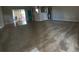 Bright living room with carpet and view to the kitchen and the sun room at 664 San Pedro Dr, The Villages, FL 32159