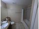 Neutral bathroom featuring a shower and bath combination and a granite vanity top at 8801 Worldquest Blvd # 4203, Orlando, FL 32821