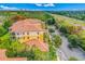 Aerial view of the building featuring lush landscaping and plentiful parking at 8801 Worldquest Blvd # 4203, Orlando, FL 32821