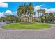 Image of the community grounds and clubhouse showing a circular driveway with lush landscaping at 8801 Worldquest Blvd # 4203, Orlando, FL 32821