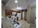 Open concept kitchen features granite countertops, double sink, and white appliances at 8801 Worldquest Blvd # 4203, Orlando, FL 32821