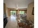 Spacious living room with tiled floor, ceiling fan, and sliding glass door to the lanai at 8801 Worldquest Blvd # 4203, Orlando, FL 32821