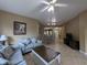 Comfortable living room with neutral tones, tile flooring, ceiling fan, and an open concept floor plan at 8801 Worldquest Blvd # 4203, Orlando, FL 32821