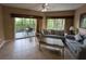Comfortable living room with sliding glass doors leading to a covered lanai at 8801 Worldquest Blvd # 4203, Orlando, FL 32821