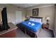 Cozy primary bedroom featuring a king-size bed with soft linens and neutral decor at 8801 Worldquest Blvd # 4203, Orlando, FL 32821