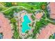 Aerial view of the large community pool with ample seating and landscaping at 8801 Worldquest Blvd # 4203, Orlando, FL 32821