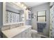 Bright bathroom features a white vanity with sink, storage, and a framed mirror with a shower and bath combo at 97 Hillside Dr, Eustis, FL 32726