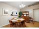 Cozy dining area with ample seating and natural light, adjacent to the kitchen at 97 Hillside Dr, Eustis, FL 32726