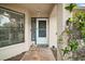 Inviting front entrance with a decorative door, sidelight window, and stylish brick paving at 97 Hillside Dr, Eustis, FL 32726