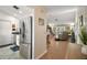 Inviting living space with hardwood floors flowing into the kitchen with stainless steel appliances at 97 Hillside Dr, Eustis, FL 32726