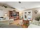 Relaxing living room featuring vaulted ceilings, comfortable seating, and access to the pool area at 97 Hillside Dr, Eustis, FL 32726