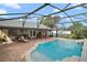 Beautiful screened-in pool area offering the perfect blend of relaxation and entertainment at 97 Hillside Dr, Eustis, FL 32726