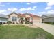 Charming single-story home with well-manicured landscaping and inviting curb appeal at 971 Caribou Way, The Villages, FL 32162