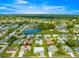 Aerial view of home in a well-maintained neighborhood with community amenities and beautiful landscaping at 9773 Se 179Th Pl, Summerfield, FL 34491