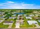 Aerial view of a home nestled in a community, surrounded by lush greenery and recreational facilities at 9773 Se 179Th Pl, Summerfield, FL 34491