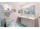 Bathroom with pink walls, white cabinets, a large mirror, and a window with curtains at 9773 Se 179Th Pl, Summerfield, FL 34491