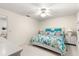 Bedroom featuring a floral-patterned bed, white furniture and carpeted floor at 9773 Se 179Th Pl, Summerfield, FL 34491