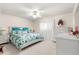 Bedroom featuring a floral-patterned bed, white furniture and carpeted floor at 9773 Se 179Th Pl, Summerfield, FL 34491