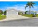 Charming single-story home featuring a two-car garage, well-maintained lawn, and inviting front entrance at 9773 Se 179Th Pl, Summerfield, FL 34491