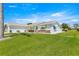 Charming single-story home featuring a two-car garage, well-maintained lawn, and inviting front entrance at 9773 Se 179Th Pl, Summerfield, FL 34491