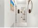 Hallway with tile floors leading to bedrooms and white walls at 9773 Se 179Th Pl, Summerfield, FL 34491