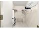 Bright walk-in closet with carpeted floor, wire shelves, and a rack for hanging clothes at 9773 Se 179Th Pl, Summerfield, FL 34491