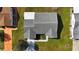 Aerial view of a home featuring a well maintained roof, a lawn, and a walkway at 9948 Se 175Th Pl, Summerfield, FL 34491