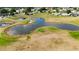 Aerial view showcasing community ponds, surrounding houses, and lush green spaces, perfect for outdoor living at 9948 Se 175Th Pl, Summerfield, FL 34491