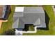 Aerial view of a home featuring a well maintained roof, a lawn, and a walkway at 9948 Se 175Th Pl, Summerfield, FL 34491