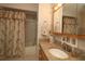 Bright bathroom featuring granite countertops and a shower-tub combination at 9948 Se 175Th Pl, Summerfield, FL 34491