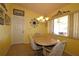Bright dining area with wainscoting and a view to an outdoor area at 9948 Se 175Th Pl, Summerfield, FL 34491