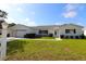 Inviting single-story home with a well-kept lawn and manicured shrubbery enhancing its curb appeal at 9948 Se 175Th Pl, Summerfield, FL 34491
