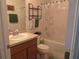 Bathroom featuring a single sink vanity with shower and tub combo, providing a functional space at 1010 Chelsea Dr, Davenport, FL 33897
