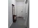 Clean, bright hallway with coat rack, leading to a welcoming white front door at 1010 Chelsea Dr, Davenport, FL 33897