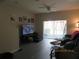 Cozy living room with a large sliding glass door, ample seating, and lots of space at 1010 Chelsea Dr, Davenport, FL 33897