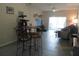 Open living room featuring a dining area and modern fixtures, providing a versatile living space at 1010 Chelsea Dr, Davenport, FL 33897