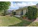 Backyard with patio, greenery, and screened lanai at 1022 Saint Ives Ct, Mount Dora, FL 32757