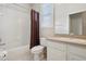 Bathroom with shower and tub, and shuttered window at 1022 Saint Ives Ct, Mount Dora, FL 32757