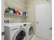 Laundry room with washer, dryer and shelving at 1022 Saint Ives Ct, Mount Dora, FL 32757