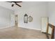 The main bedroom features ample space and a neutral color palette, creating a cozy and inviting atmosphere at 1022 Saint Ives Ct, Mount Dora, FL 32757