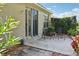 Patio with seating overlooking landscaped backyard at 1022 Saint Ives Ct, Mount Dora, FL 32757