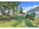 Expansive backyard featuring mature landscaping and a well-maintained lawn at 10257 Dovehill Ln, Clermont, FL 34711