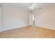 Bedroom with wood-look tile floor, ceiling fan, and neutral color scheme at 10257 Dovehill Ln, Clermont, FL 34711