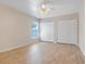 Bedroom with a window, ceiling fan, and double closets with sliding doors at 10257 Dovehill Ln, Clermont, FL 34711