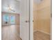 Bedroom walk-in closet with wood-look tile floors and wire shelving at 10257 Dovehill Ln, Clermont, FL 34711
