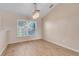 Bright open dining room featuring wood floors and modern light fixture at 10257 Dovehill Ln, Clermont, FL 34711