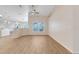 Large open concept living area with wood floors and natural light at 10257 Dovehill Ln, Clermont, FL 34711