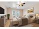 Comfortable bedroom with queen size bed and natural light at 10257 Dovehill Ln, Clermont, FL 34711